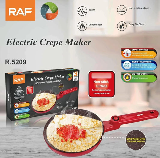 Electric crepe maker with non-stick surface, red handle, and fresh crepe cooking in pan