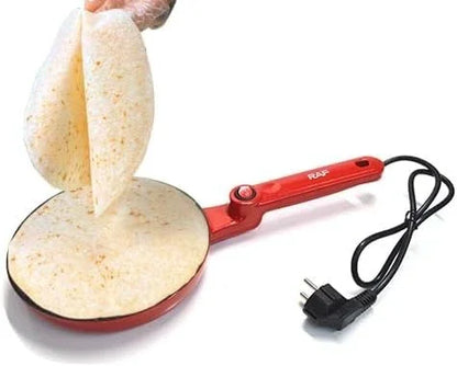 Electric roti maker with non-stick surface making fresh flatbreads, hand lifting roti