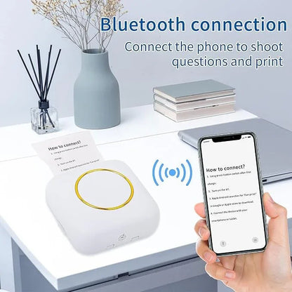Bluetooth thermal printer on desk, smartphone connecting wirelessly for photo and note printing