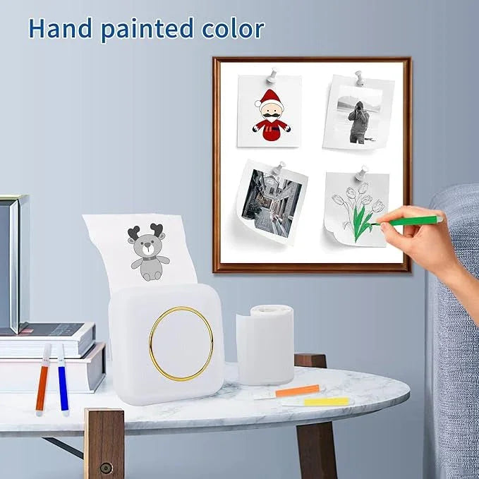 Mini thermal printer on table printing cartoon image, hand coloring printed photo, creative display